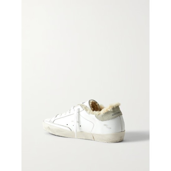 Superstar shearling-lined distressed glittered leather sneakers